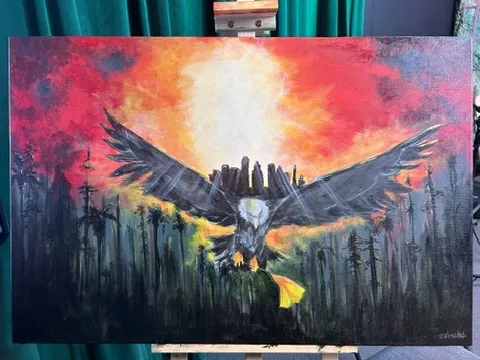 Painting of an eagle in flight against a burning sunset