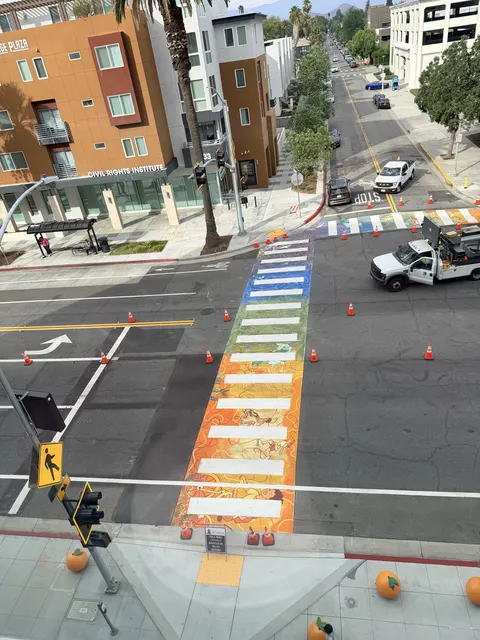 Rainbow crosswalk Maryam painted in front of the Riverside Public Library, seen from above