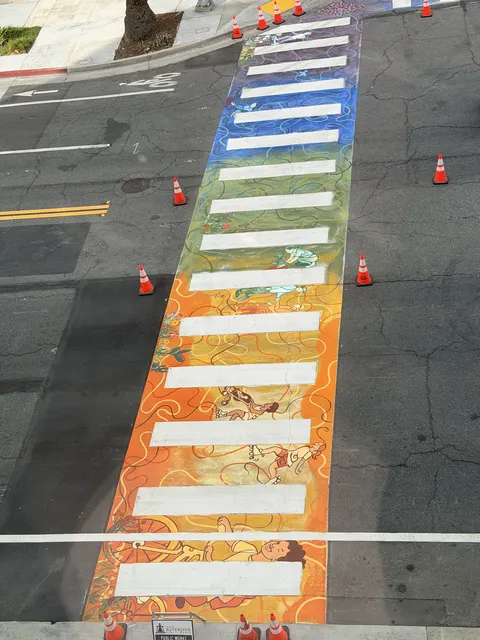 The full length of the Riverside Public Library crosswalk in rainbow bands