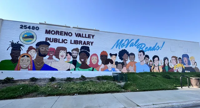 MoVal Reads! mural of diverse faces along the Moreno Valley Public Library