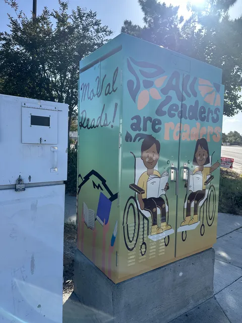 Moreno Valley utility box with kids reading, one in a wheelchair