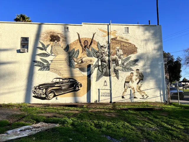 Park Avenue mural of a stairway, a vintage car and a figure reaching up