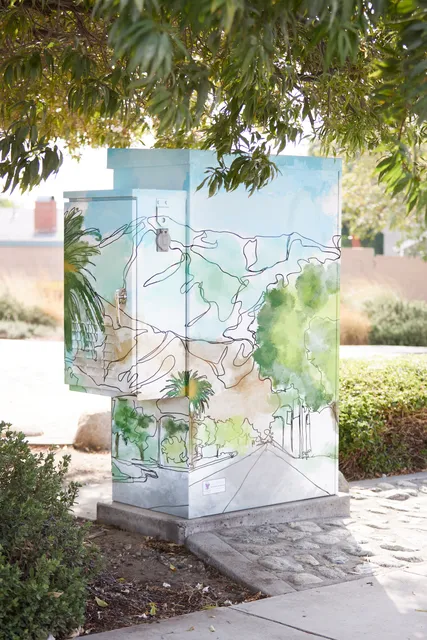 Rancho Cucamonga utility box painted with line drawings of mountains and palms